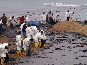 People cleaning up the spill